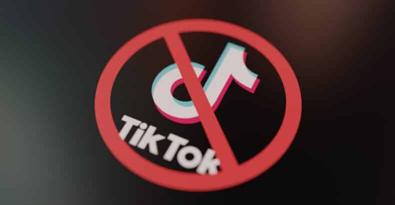 TikTok Logo with a crossed out sign through it.